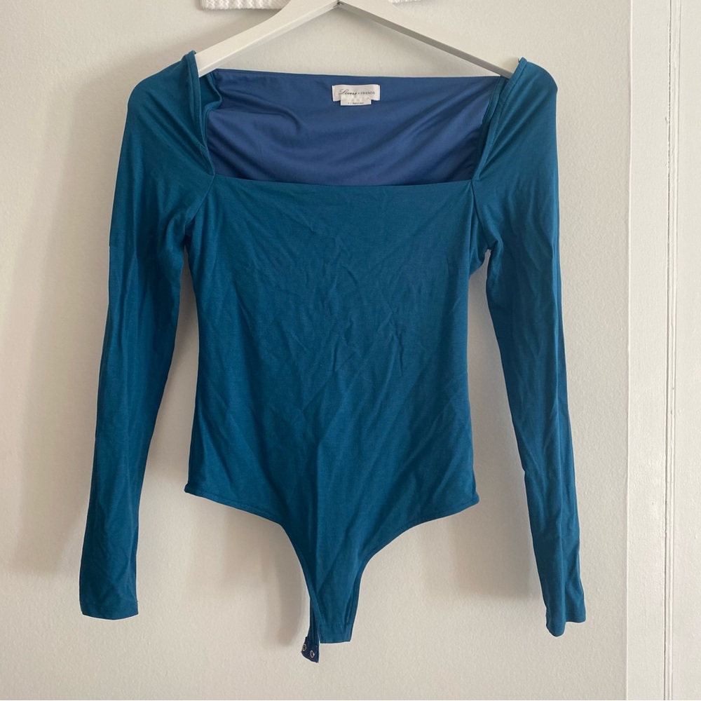 Lovers and Friends turquoise blue body suit, long sleeve. Excellent condition.